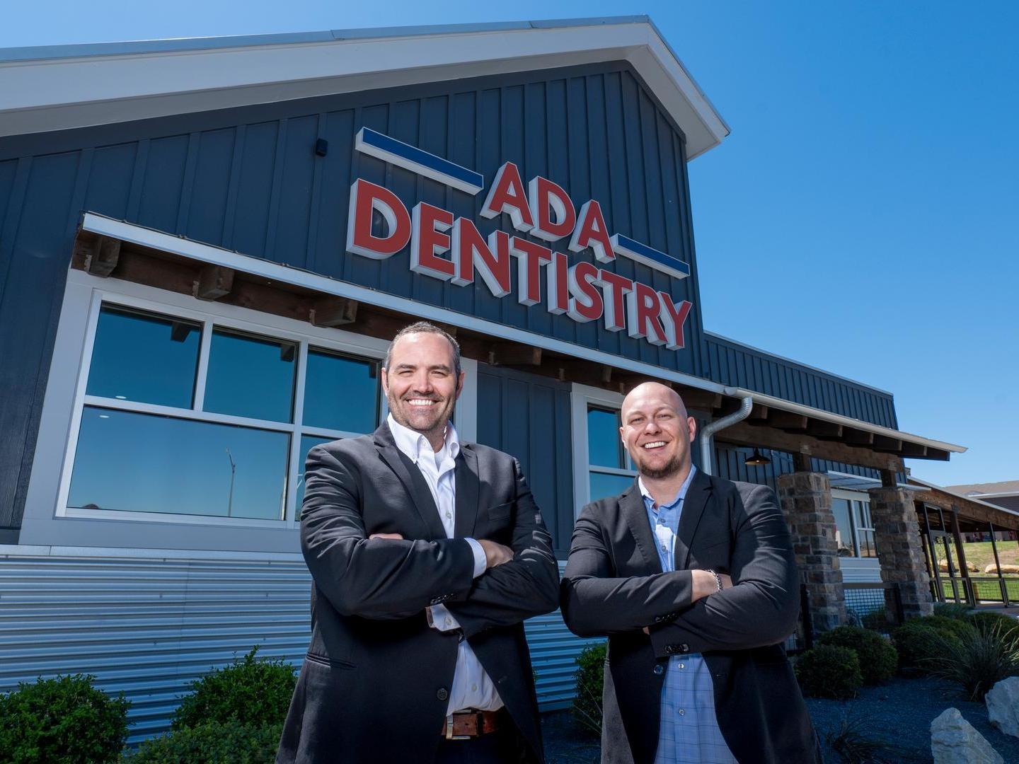 Photo of Dentists in front of Clinic